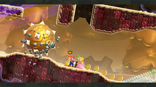 Daisy, Mario, Luigi et Peach fond face à une boule de pics géante